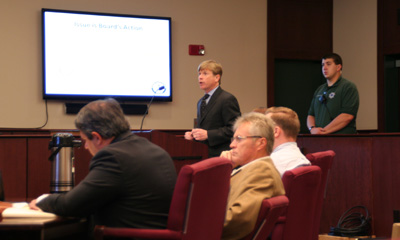 The school district's attorney Todd Presnell argued that the board had a policy that requests be in person or by US Postal service. In the foreground is Kirk Clements and Ken Jakes.